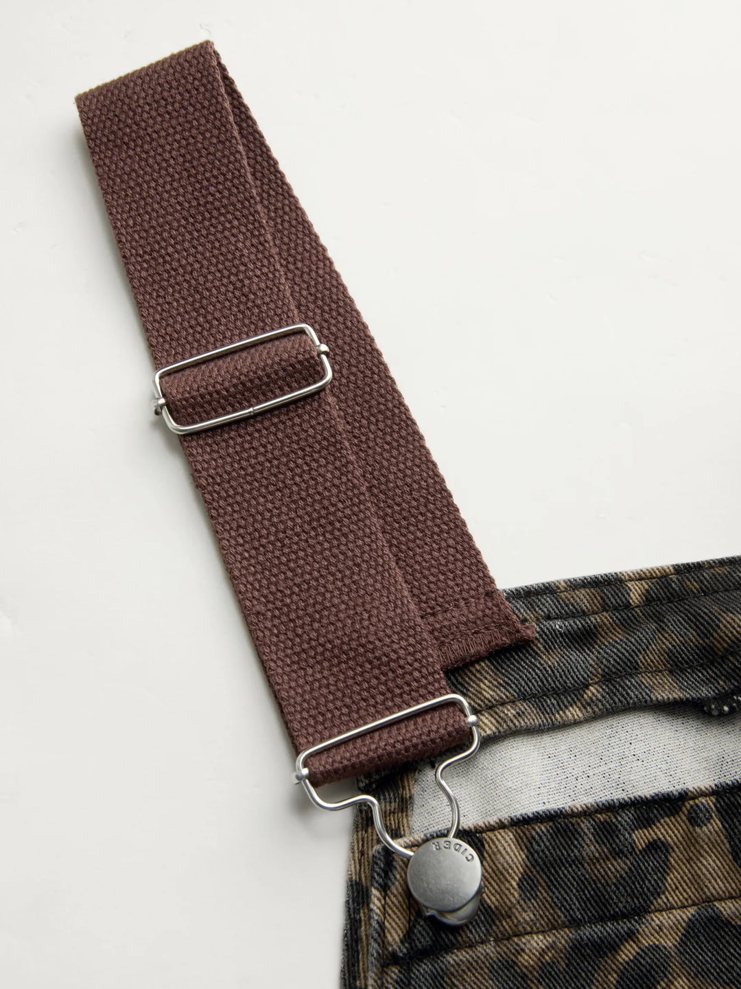 Wide-Leg Denim Jumpsuit with Buckle Closure and Leopard-Print Pocket